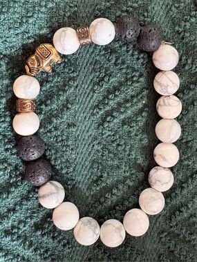 Howlite and Black Lava Bead Stretch Bracelet with Gold Elephant Accent